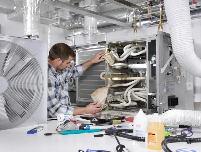 Valley Falls Air Duct Cleaning specialist performing precision AC coil cleaning in Valley Falls