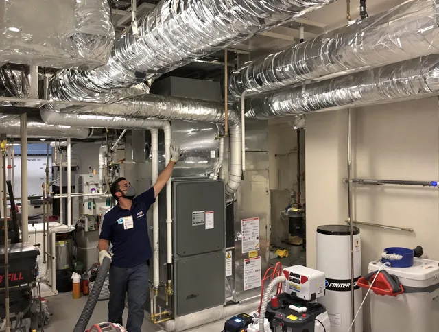 Valley Falls Air Duct Cleaning specialist performing thorough furnace duct cleaning in a Valley Falls residence