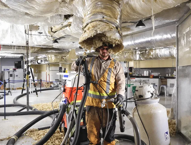 Professional vacuum insulation removal by Valley Falls Air Duct Cleaning expert in Valley Falls